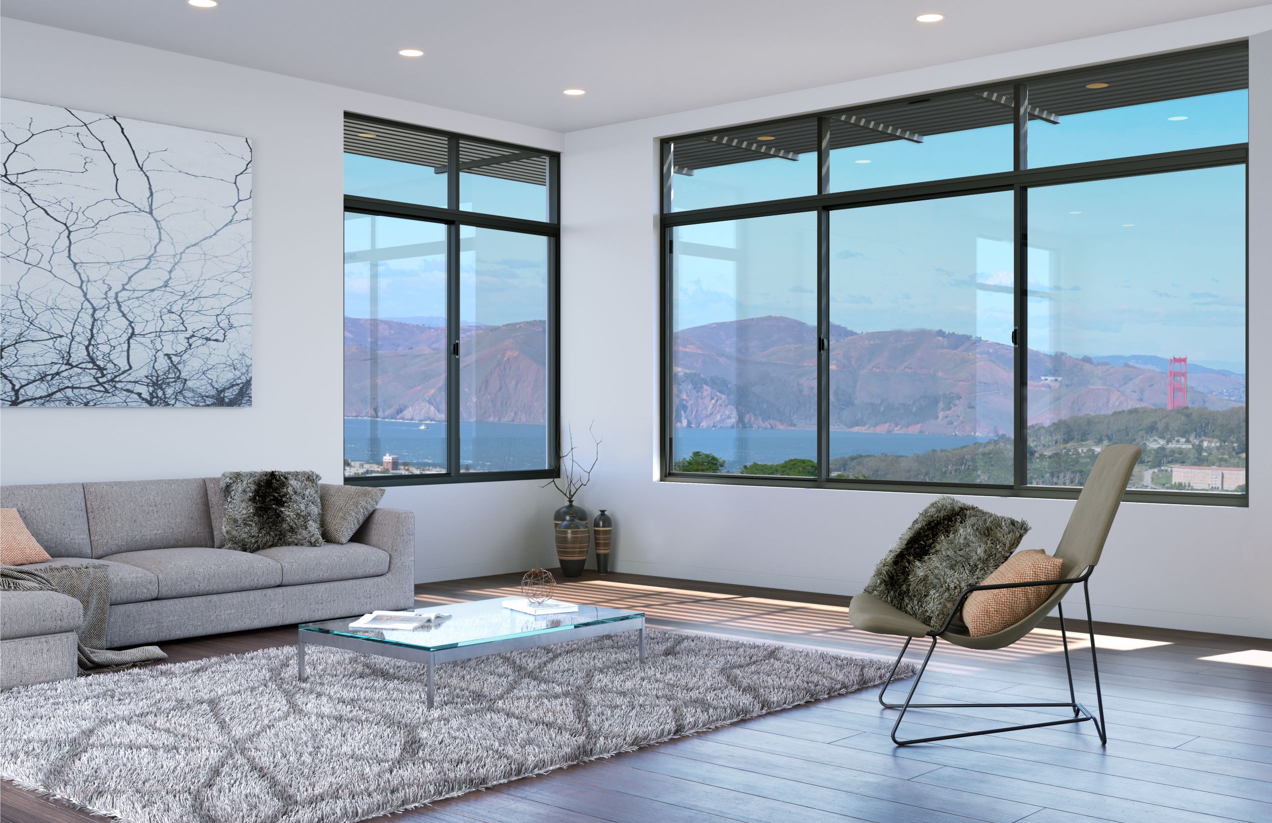 allweather sliding Modern living room with large windows offering a scenic view of hills and a distant bridge. The room features a gray sofa, a glass coffee table, a shag rug, and a modern chair with cushions.